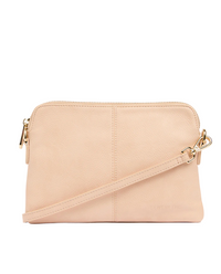 Beige crossbody bag with gold zipper on a white background