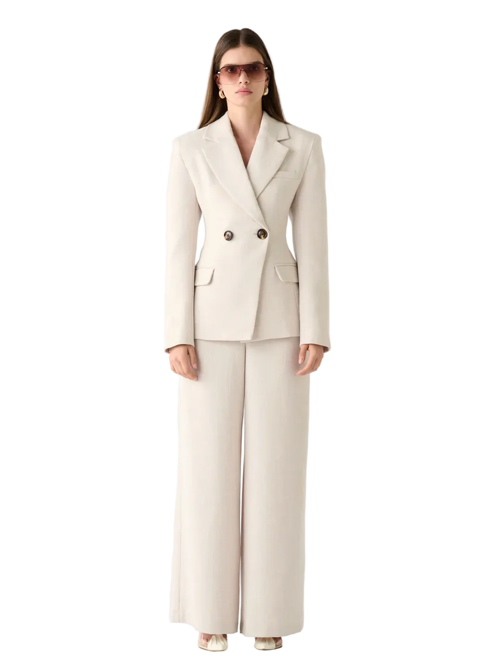 Woman wearing a beige suit on a white background