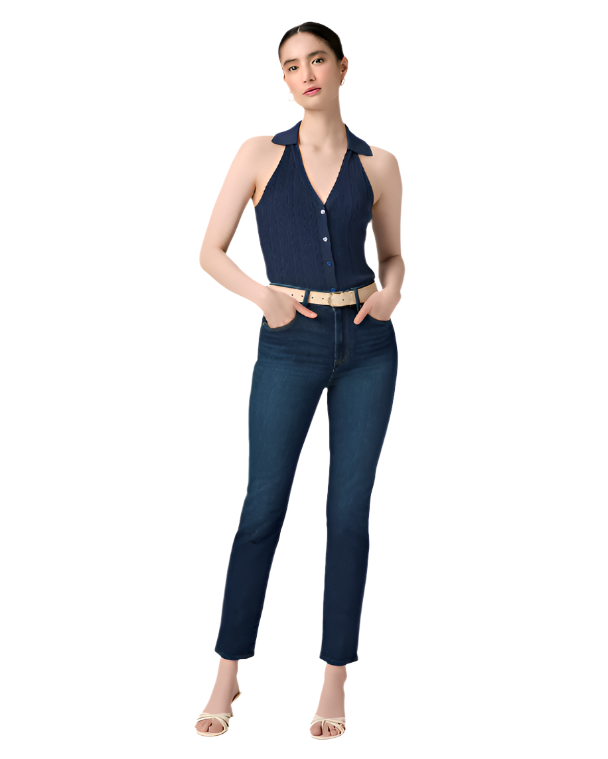Woman wearing a dark blue sleeveless top and jeans